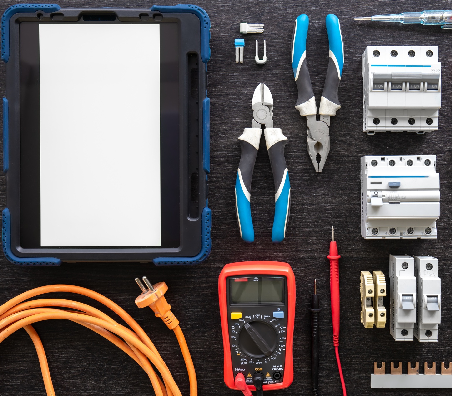 Flat lay composition with electrical tools and digital tablet on wooden background. S